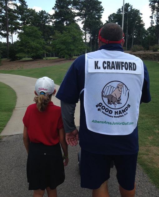 Kailey Crawford with her dad as caddy