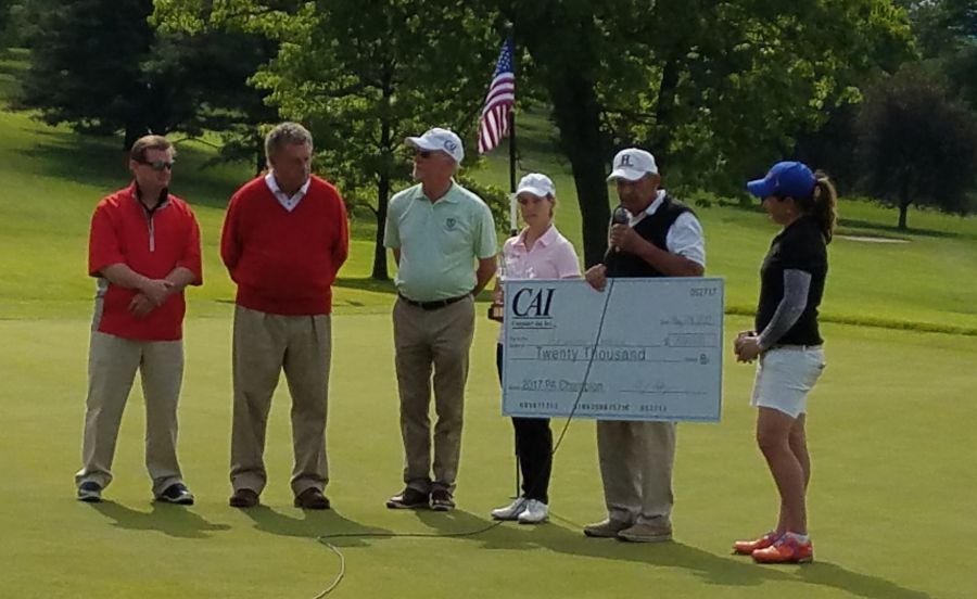 Champion Alejandra Llaneza accepts her $20,000 Championship check from the PA Women's Open Tourney staff.