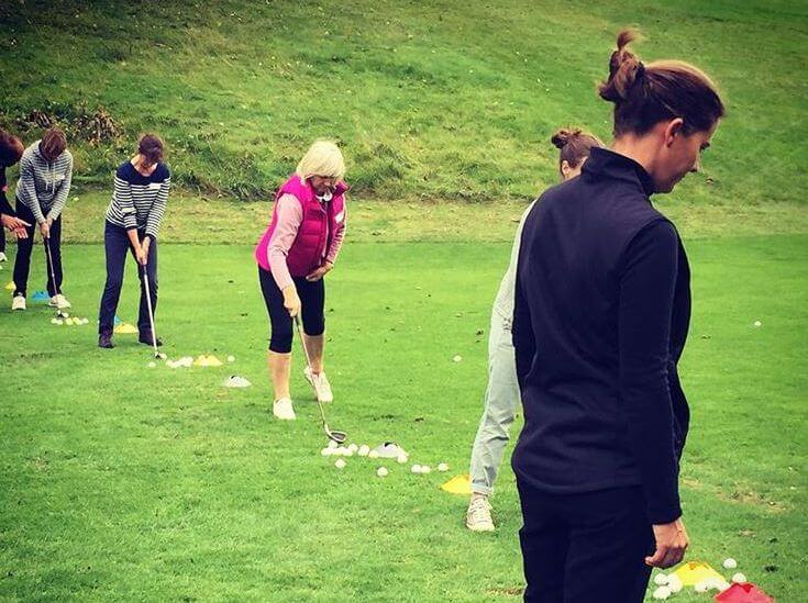 Lizzy Freemantle teaching womens golf class